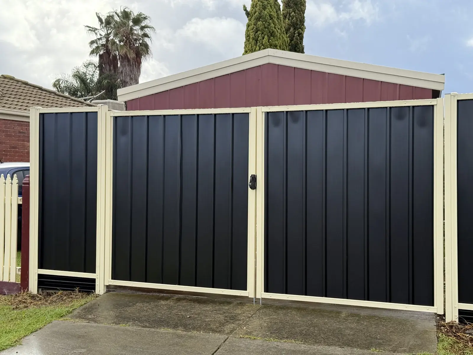 Two-tone steel driveway gates