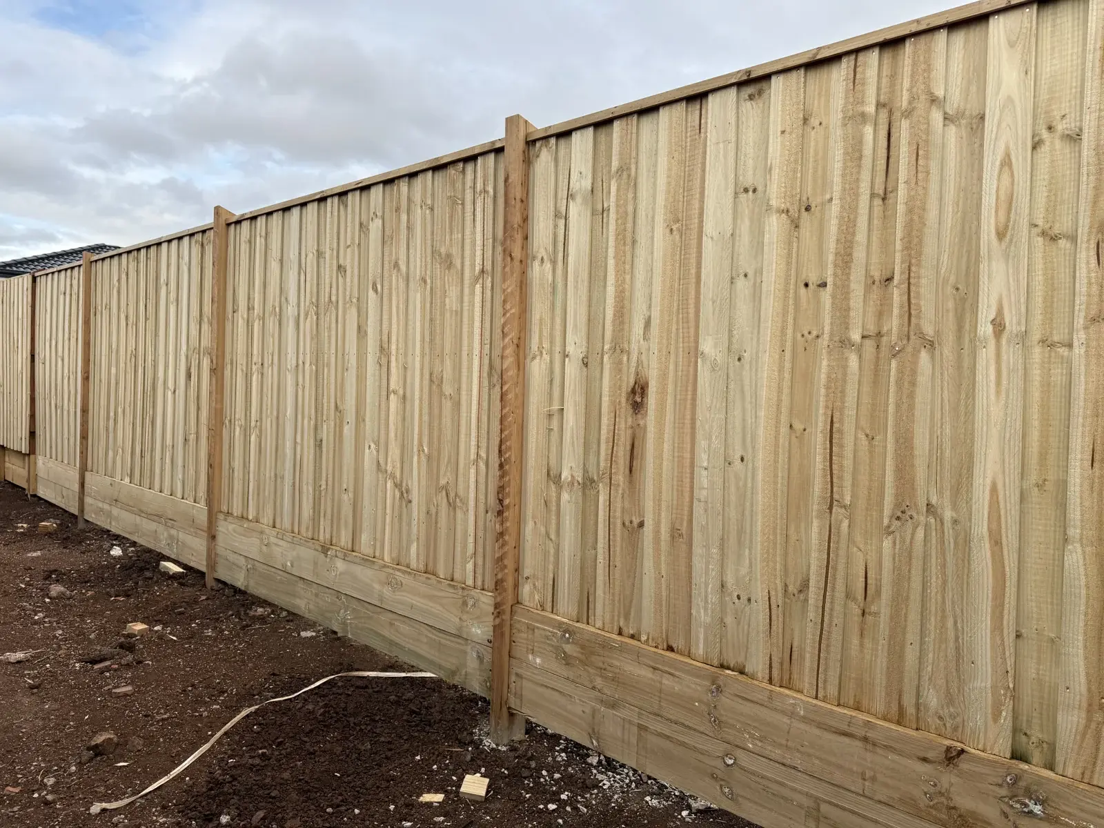 Detail of timber fence palings and capping
